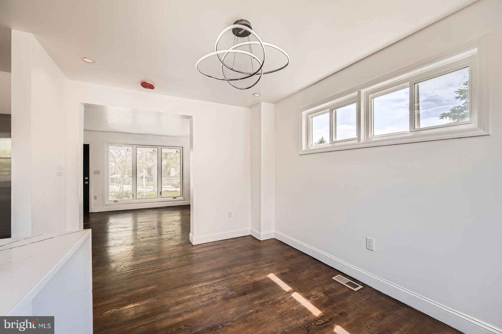 6200 Falkirk Road Baltimore, MD 21239 - Photo 9 of 27 a view of empty room with wooden floor and fan