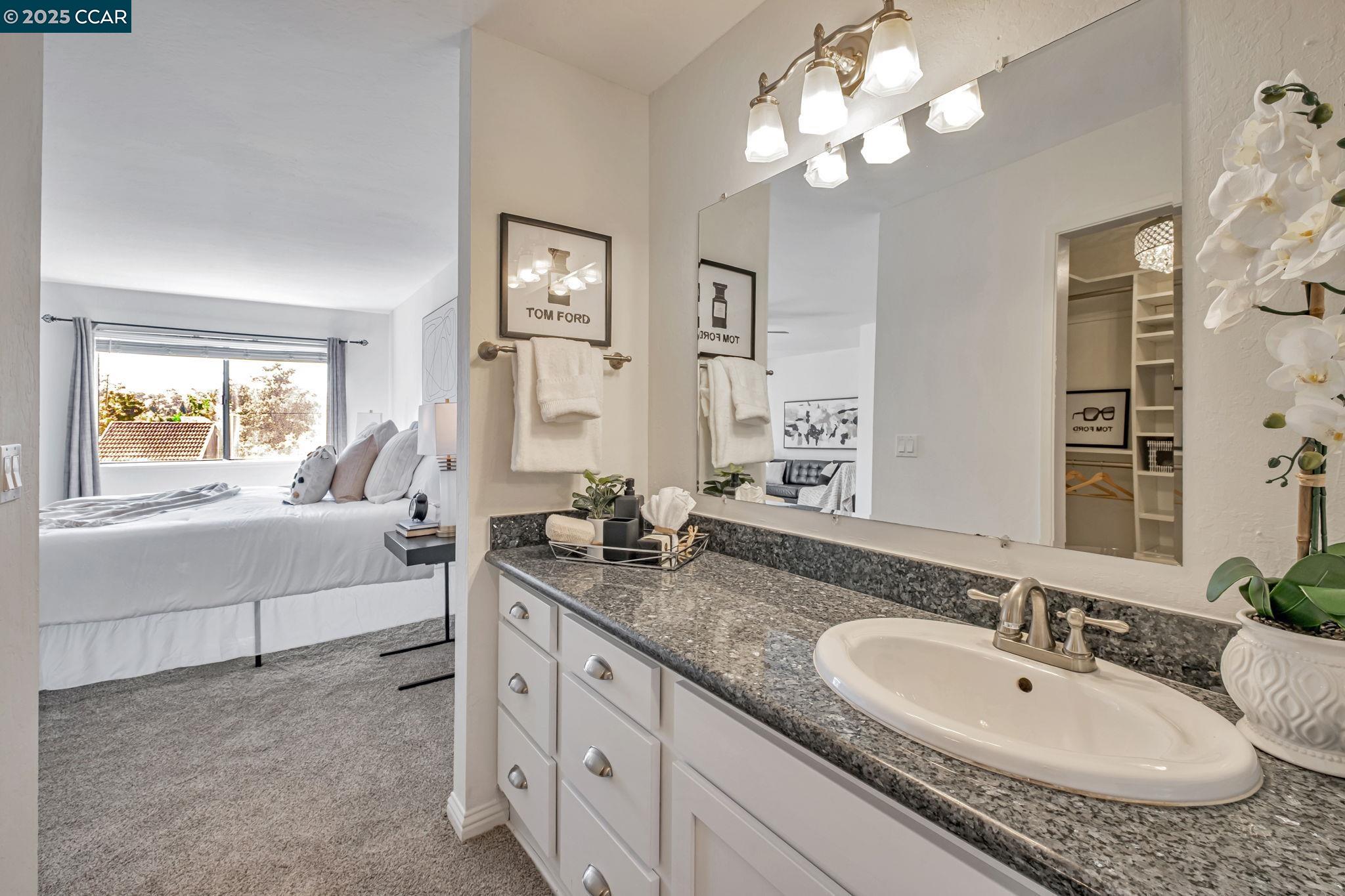 849 Tampico Walnut Creek, CA 94598 - Photo 19 of 24 a bathroom with a granite countertop sink and a mirror