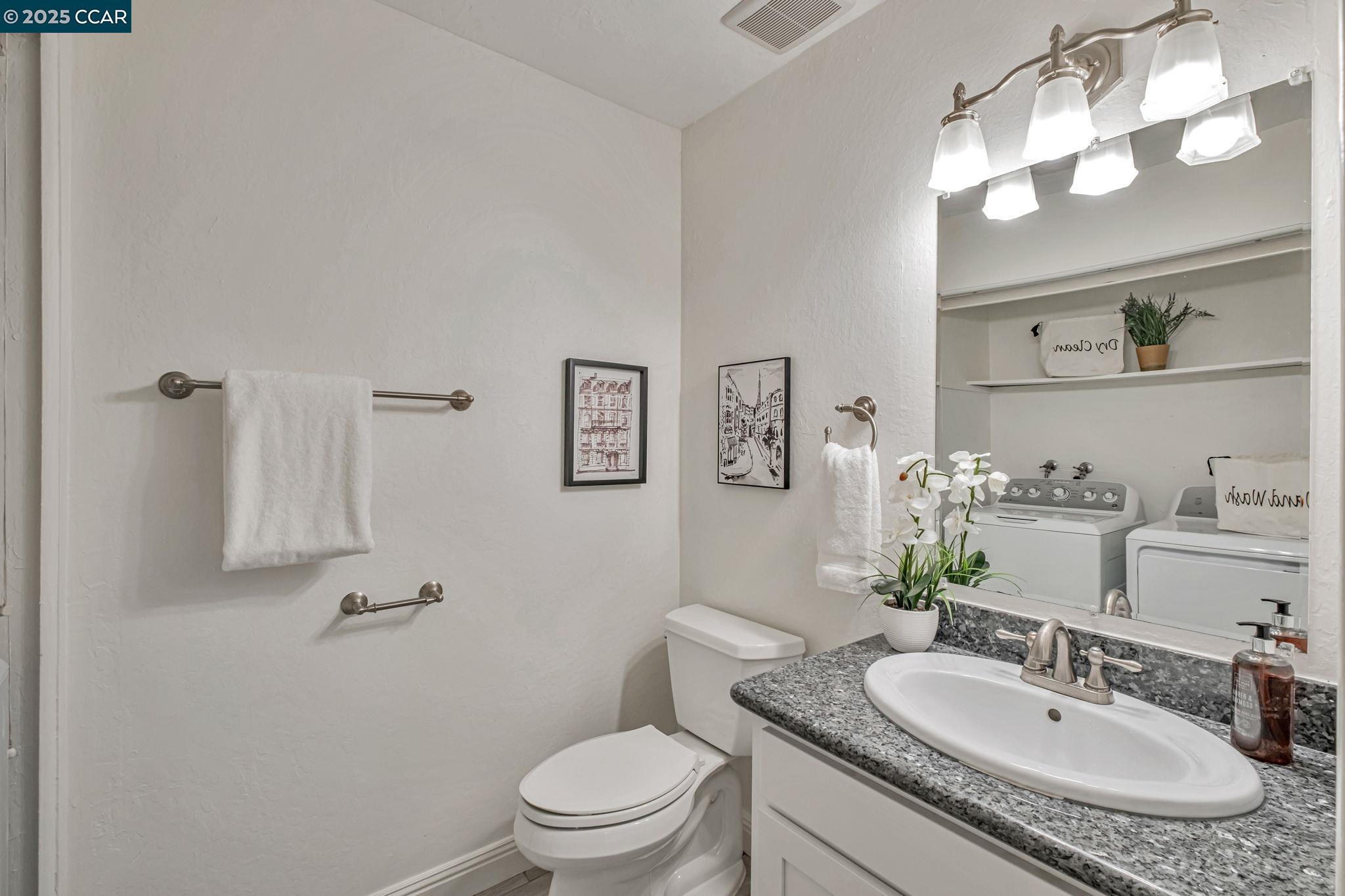 849 Tampico Walnut Creek, CA 94598 - Photo 9 of 24 a bathroom with a granite countertop sink mirror vanity and toilet
