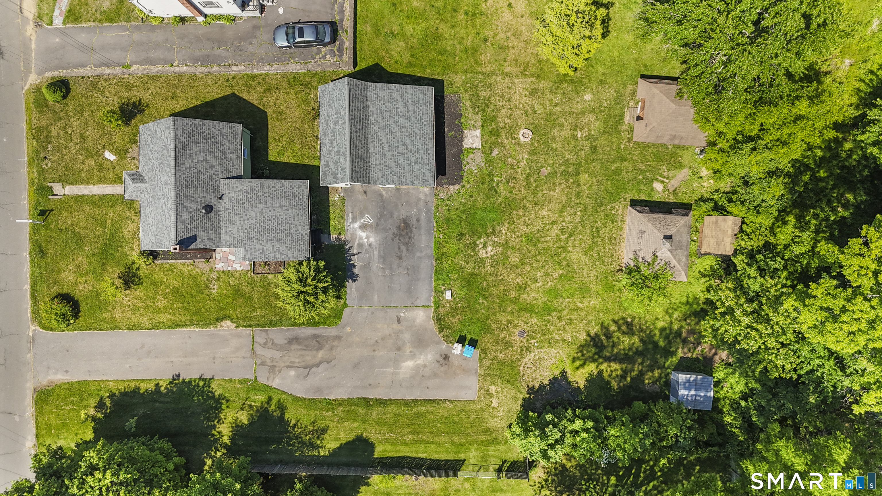 175 Moody Street Bristol, CT 06010 - Photo 6 of 28 an aerial view of a house with a yard and large trees