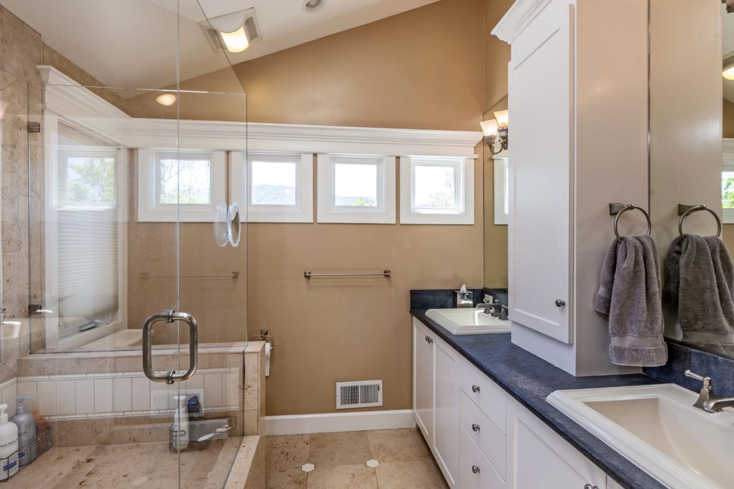 915 Cherrystone Drive Los Gatos, CA 95032 - Photo 19 of 37 a bathroom with a granite countertop sink and a mirror