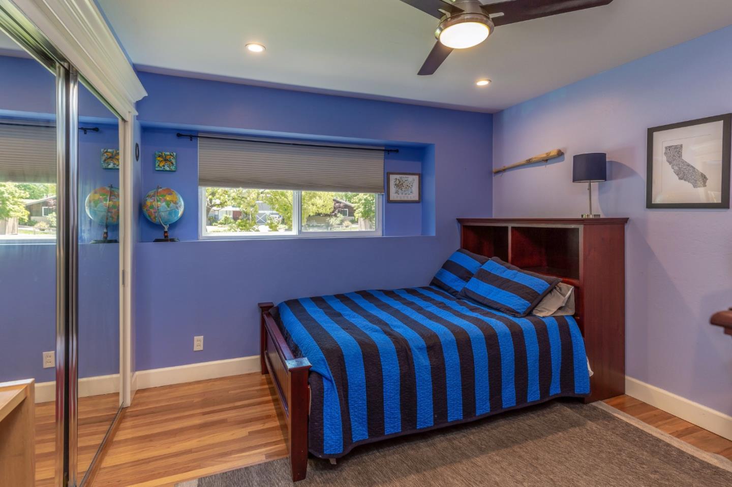 915 Cherrystone Drive Los Gatos, CA 95032 - Photo 21 of 37 a bedroom with a bed and a chandelier