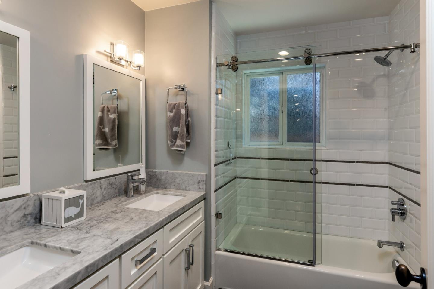 915 Cherrystone Drive Los Gatos, CA 95032 - Photo 24 of 37 a bathroom with a granite countertop shower sink and mirror