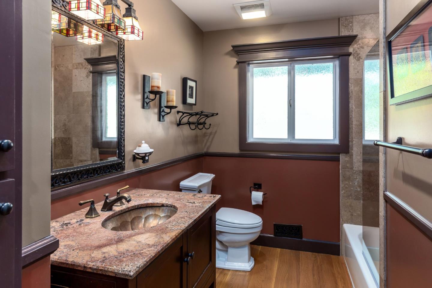 915 Cherrystone Drive Los Gatos, CA 95032 - Photo 25 of 37 a bathroom with a toilet sink and mirror