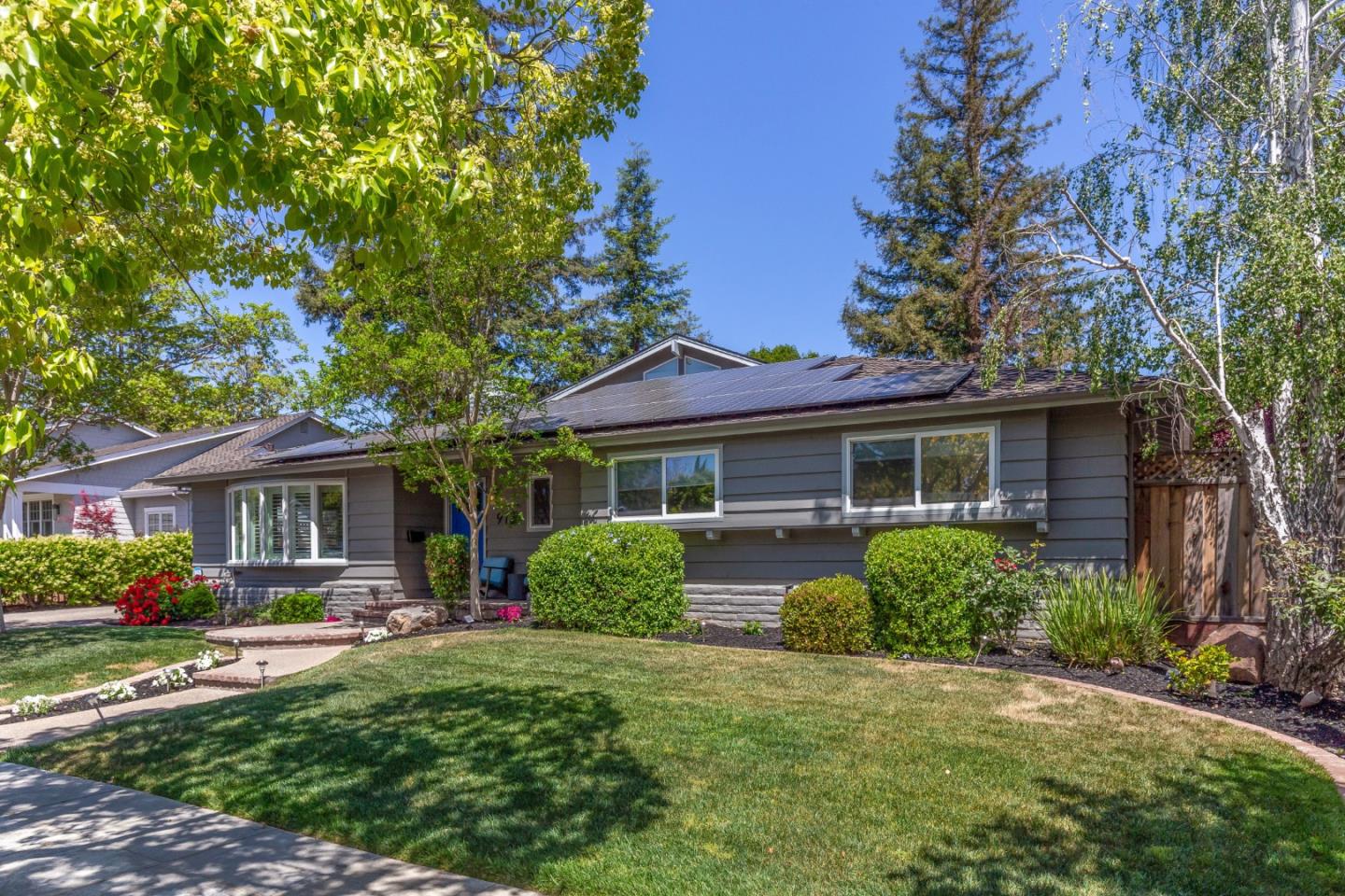 915 Cherrystone Drive Los Gatos, CA 95032 - Photo 3 of 37 a front view of a house with a yard