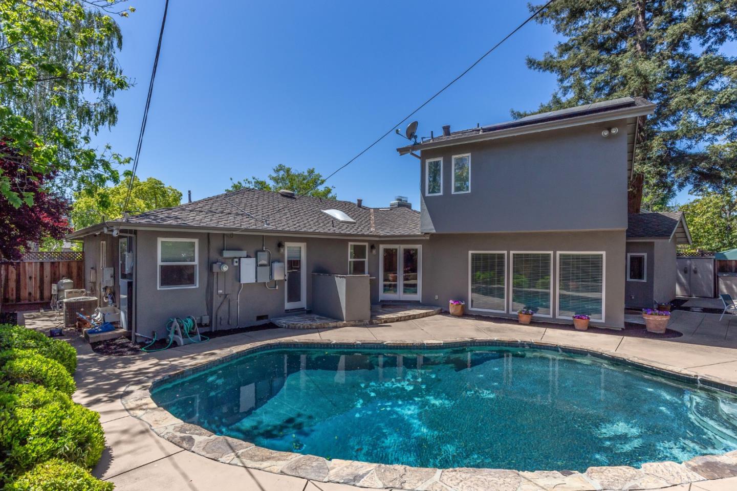 915 Cherrystone Drive Los Gatos, CA 95032 - Photo 32 of 37 a front view of a house with swimming pool having outdoor seating