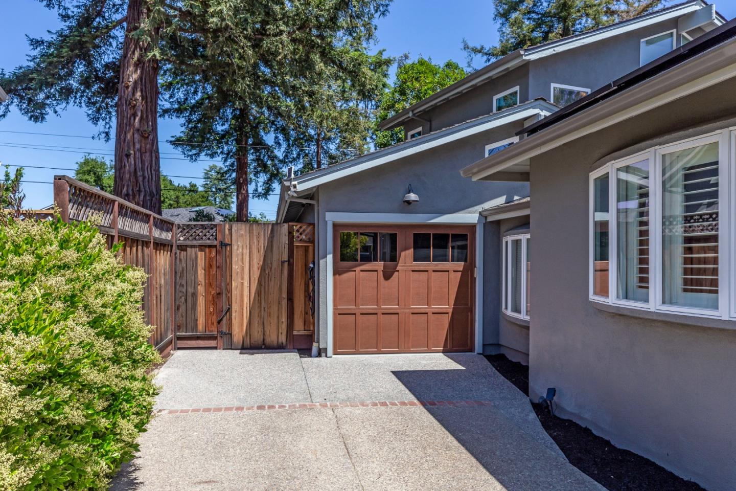 915 Cherrystone Drive Los Gatos, CA 95032 - Photo 7 of 37 a front view of a house with a garden