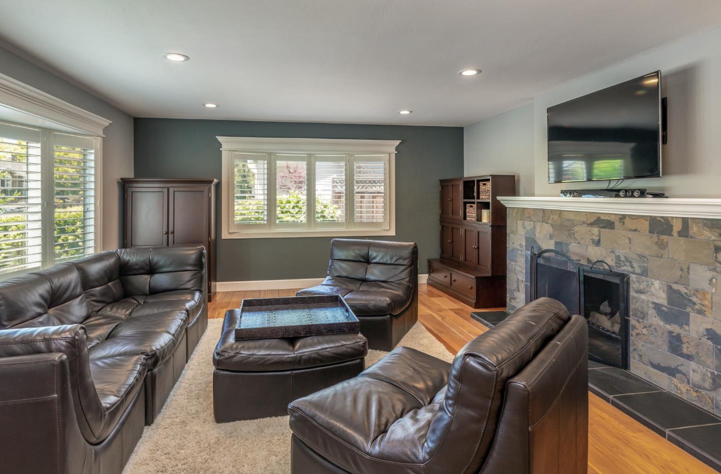 915 Cherrystone Drive Los Gatos, CA 95032 - Photo 8 of 37 a living room with furniture and a flat screen tv