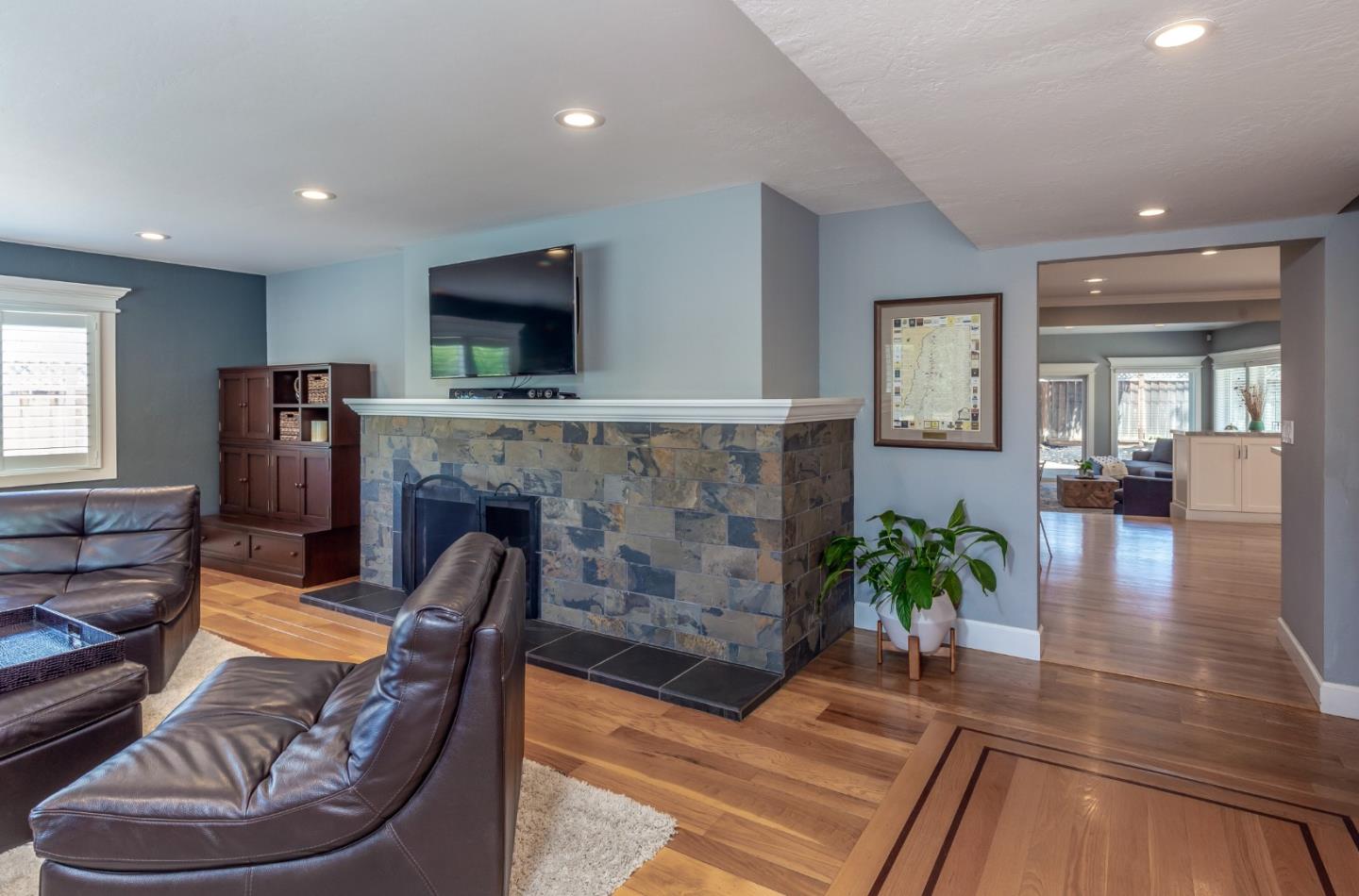 915 Cherrystone Drive Los Gatos, CA 95032 - Photo 9 of 37 a living room with furniture and a fireplace