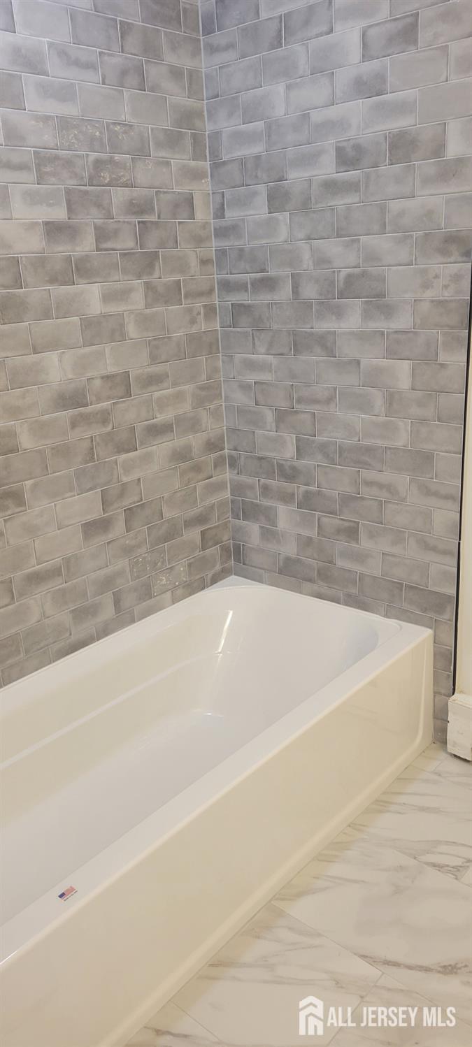 358 Raritan Street, Unit F South Amboy, NJ 08879 - Photo 4 of 5 a bathroom with a bathtub