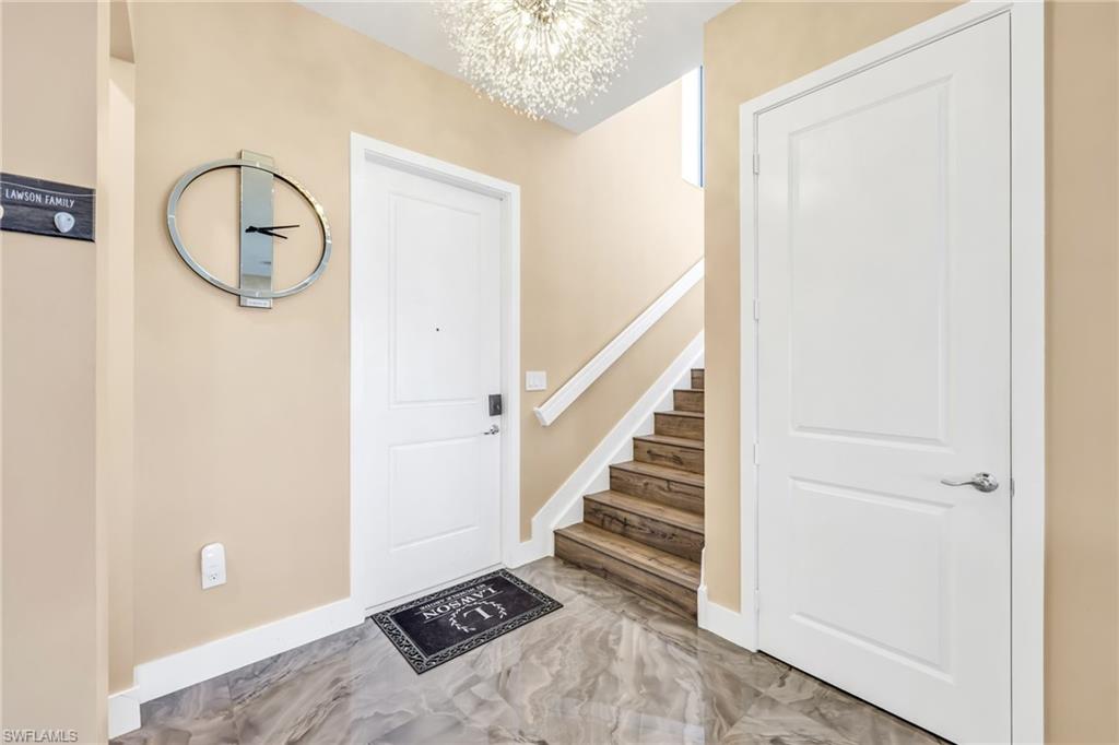 5074 Panella Avenue Immokalee, FL 34142 - Photo 14 of 48 a view of a livingroom with wooden floor and entryway
