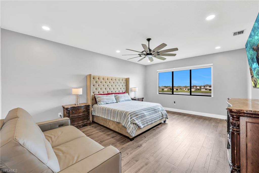 5074 Panella Avenue Immokalee, FL 34142 - Photo 16 of 48 a living room with a bed furniture and kitchen view