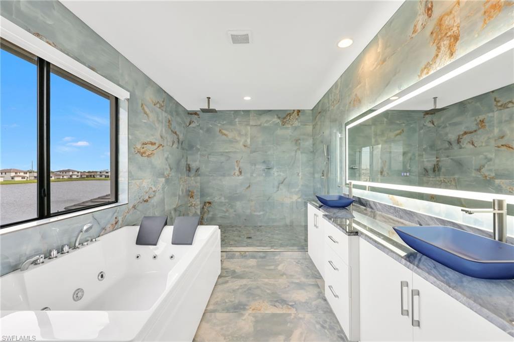 5074 Panella Avenue Immokalee, FL 34142 - Photo 18 of 48 a bathroom with a bathtub and a sink