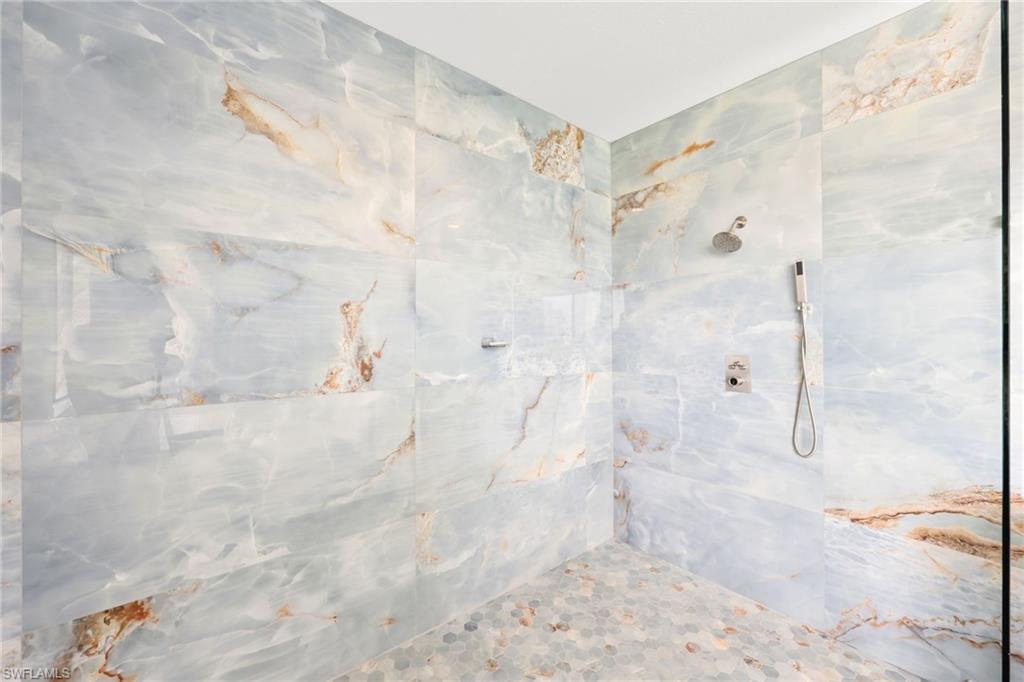 5074 Panella Avenue Immokalee, FL 34142 - Photo 19 of 48 a view of a bathroom shower and a shower