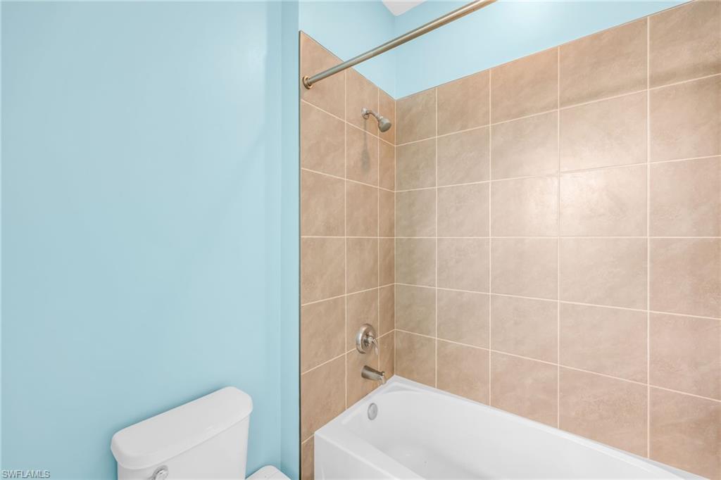 5074 Panella Avenue Immokalee, FL 34142 - Photo 24 of 48 a bathroom with a bathtub and toilet