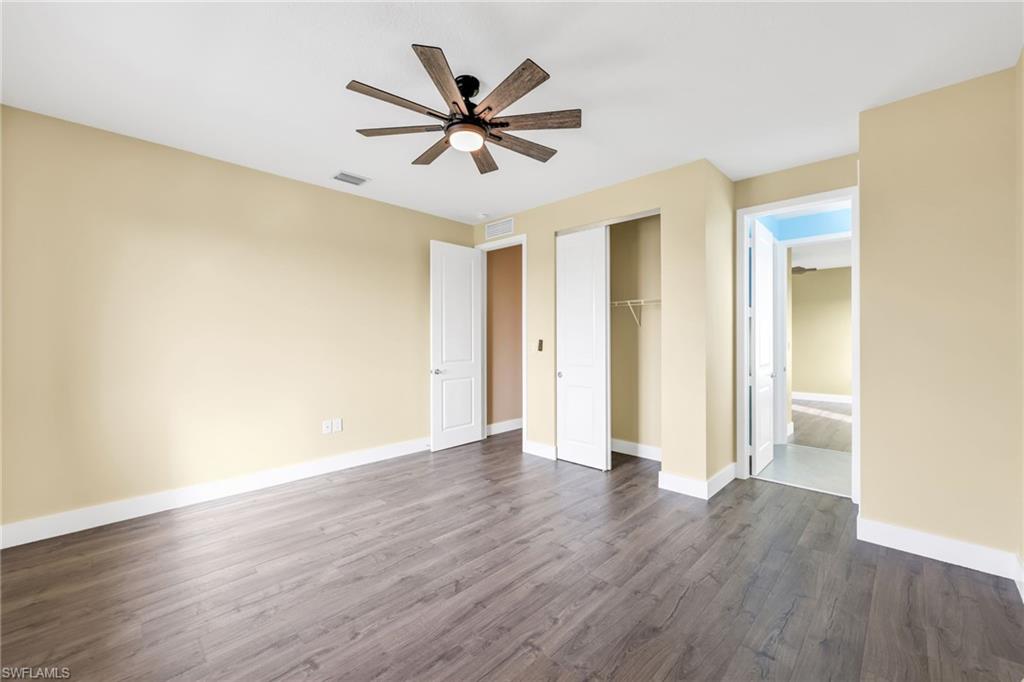 5074 Panella Avenue Immokalee, FL 34142 - Photo 25 of 48 wooden floor in an empty room