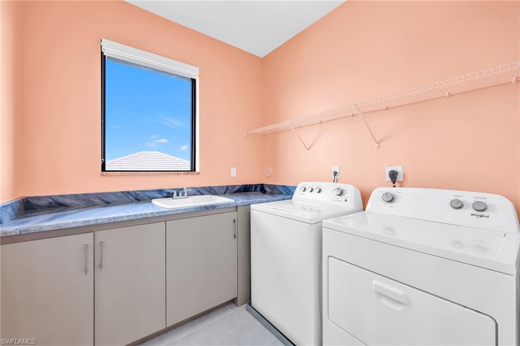 5074 Panella Avenue Immokalee, FL 34142 - Photo 27 of 48 a utility room with dryer and washer