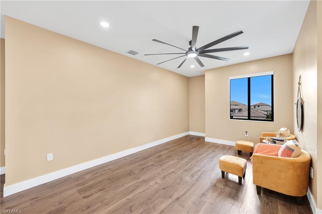 5074 Panella Avenue Immokalee, FL 34142 - Photo 28 of 48 a living room with furniture and a ceiling fan