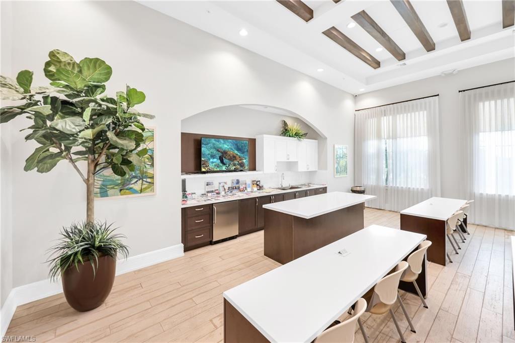5074 Panella Avenue Immokalee, FL 34142 - Photo 42 of 48 a living room with stainless steel appliances kitchen island furniture and a potted plant