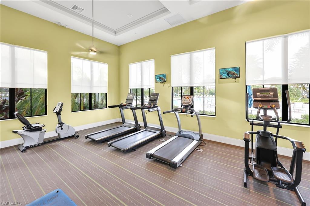 5074 Panella Avenue Immokalee, FL 34142 - Photo 44 of 48 a living room with furniture pool table and large windows