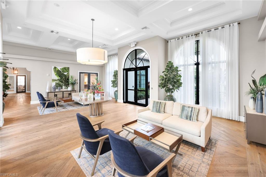 5074 Panella Avenue Immokalee, FL 34142 - Photo 46 of 48 a living room with furniture and a chandelier