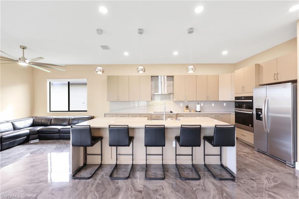 5074 Panella Avenue Immokalee, FL 34142 - Photo 6 of 48 a kitchen with a table and chairs in it