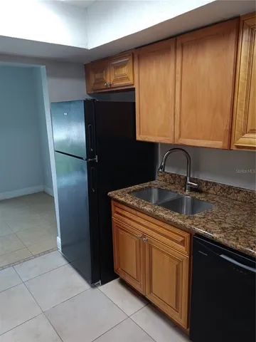 a view of an empty room and wooden floor