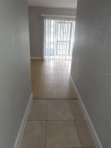 a bathroom with a granite countertop toilet and a bathtub