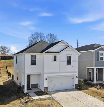 a front view of a house with a garage