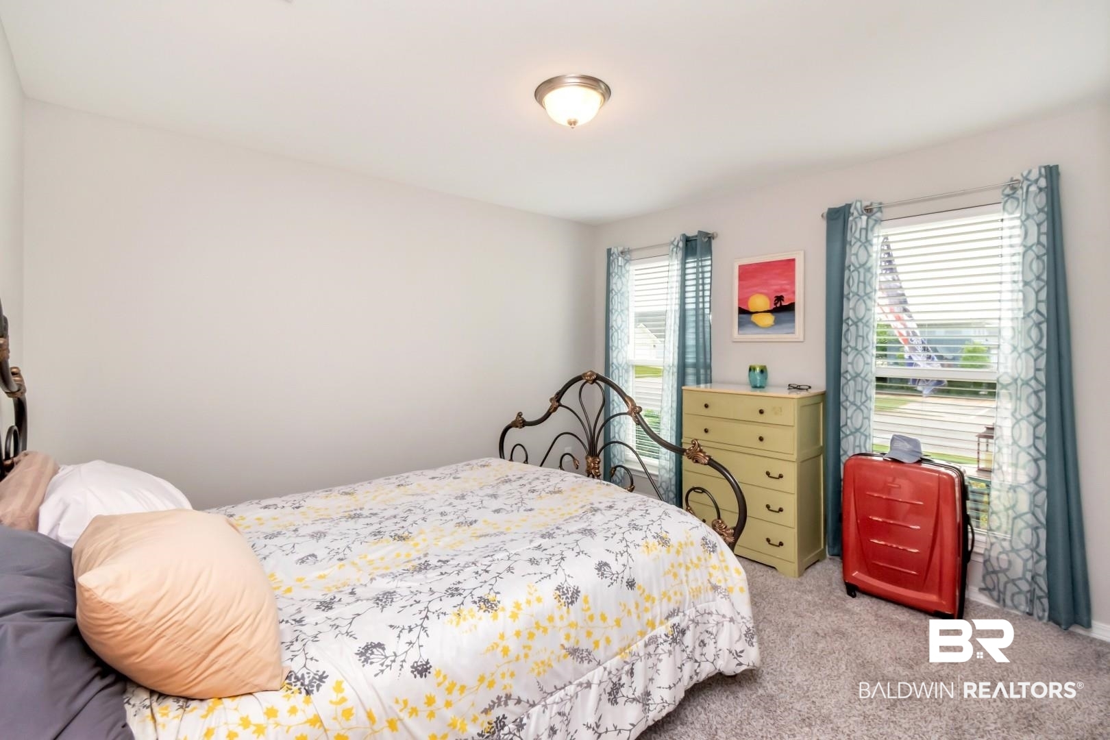 1295 Hayward Loop Foley, AL 36535 - Photo 19 of 29 Carpeted bedroom featuring light-toned walls, two windows with blinds, and a ceiling-mounted light fixture