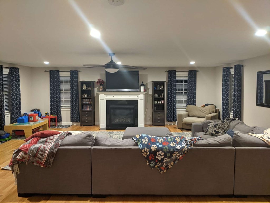 1 Quail Ridge Road Merrimac, MA 01860 - Photo 12 of 15 a living room with furniture fireplace and flat screen tv