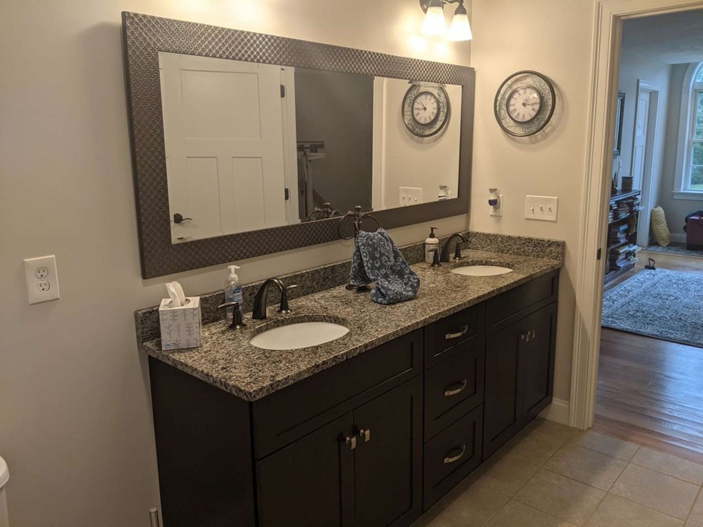 1 Quail Ridge Road Merrimac, MA 01860 - Photo 6 of 15 a bathroom with a granite countertop double vanity sink and a mirror