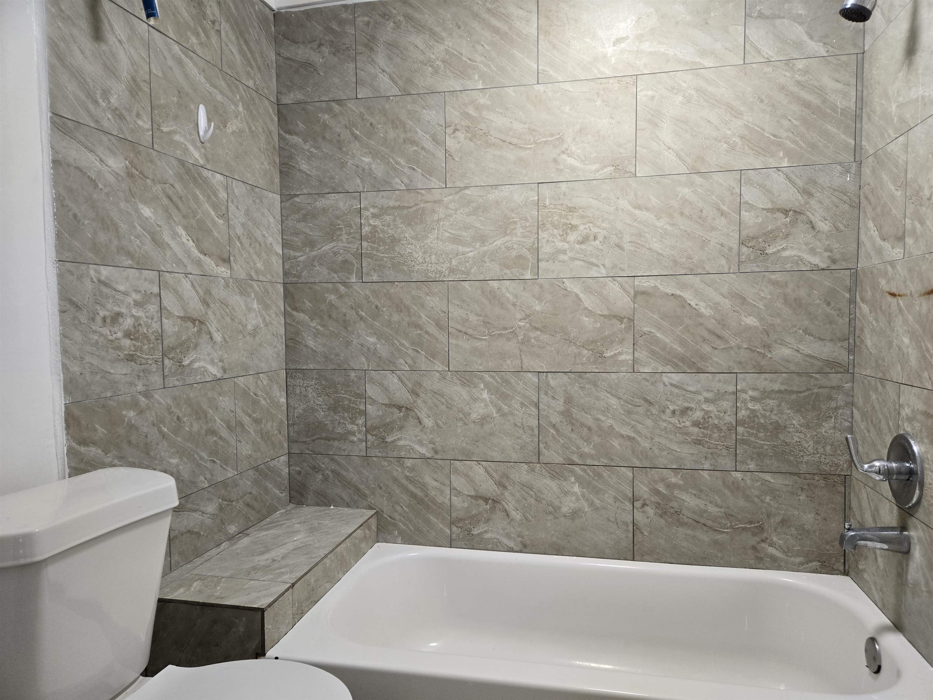 3053 Carrington Road Memphis, TN 38111 - Photo 8 of 17 Bathroom featuring toilet and tiled shower / bath