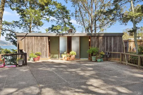 a view of a chairs and table in the patio