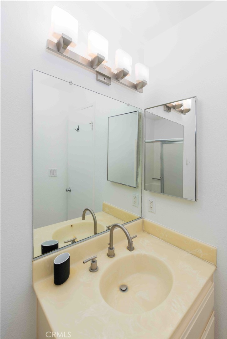 7135 Firmament Avenue, Unit 25 Van Nuys, CA 91406 - Photo 11 of 14 a bathroom with a sink and a mirror