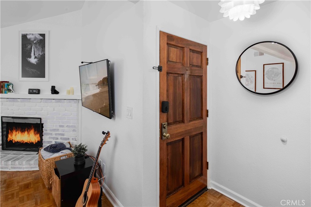 7135 Firmament Avenue, Unit 25 Van Nuys, CA 91406 - Photo 2 of 14 a view of a livingroom with furniture and a fireplace