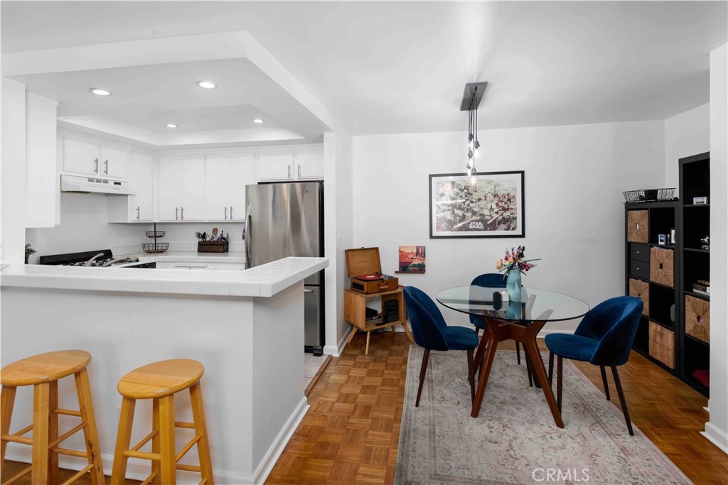 7135 Firmament Avenue, Unit 25 Van Nuys, CA 91406 - Photo 3 of 14 a view of a dining room with furniture