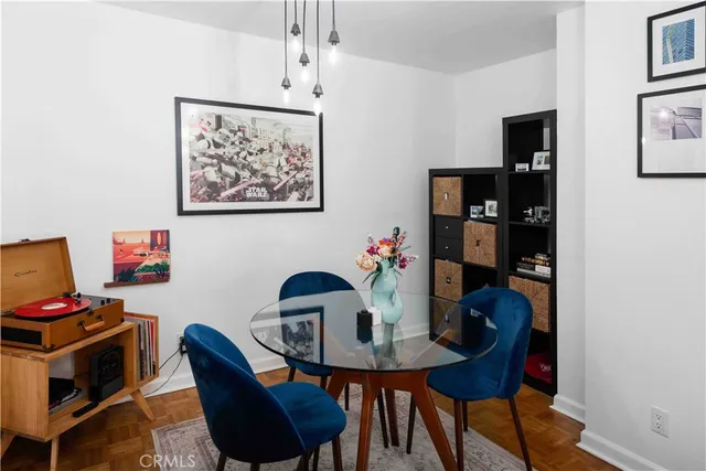 a view of a dining room with furniture and wooden floor