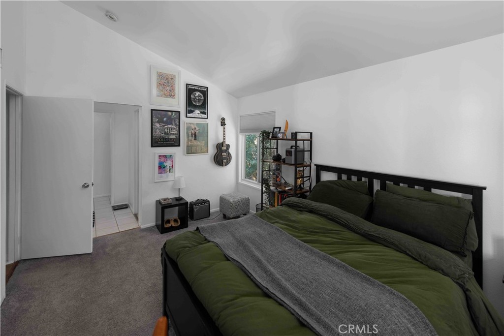 7135 Firmament Avenue, Unit 25 Van Nuys, CA 91406 - Photo 7 of 14 a bedroom with a bed and a couch