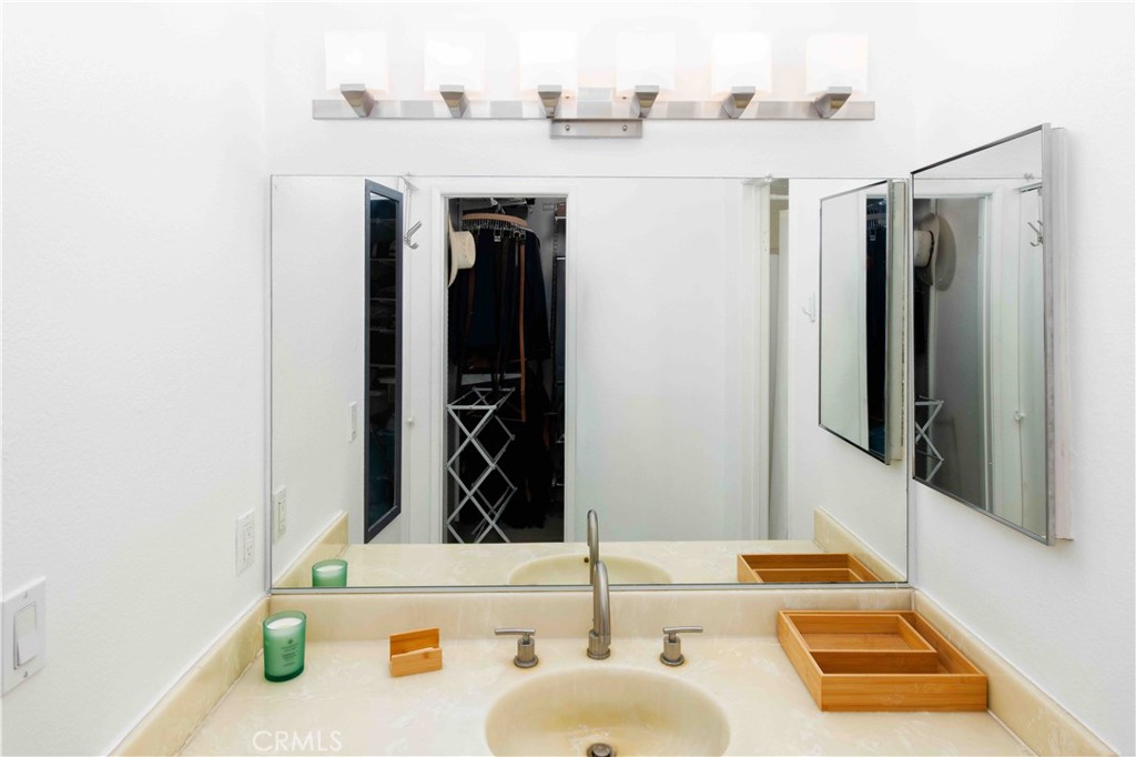 7135 Firmament Avenue, Unit 25 Van Nuys, CA 91406 - Photo 10 of 14 a bathroom with a sink and a mirror