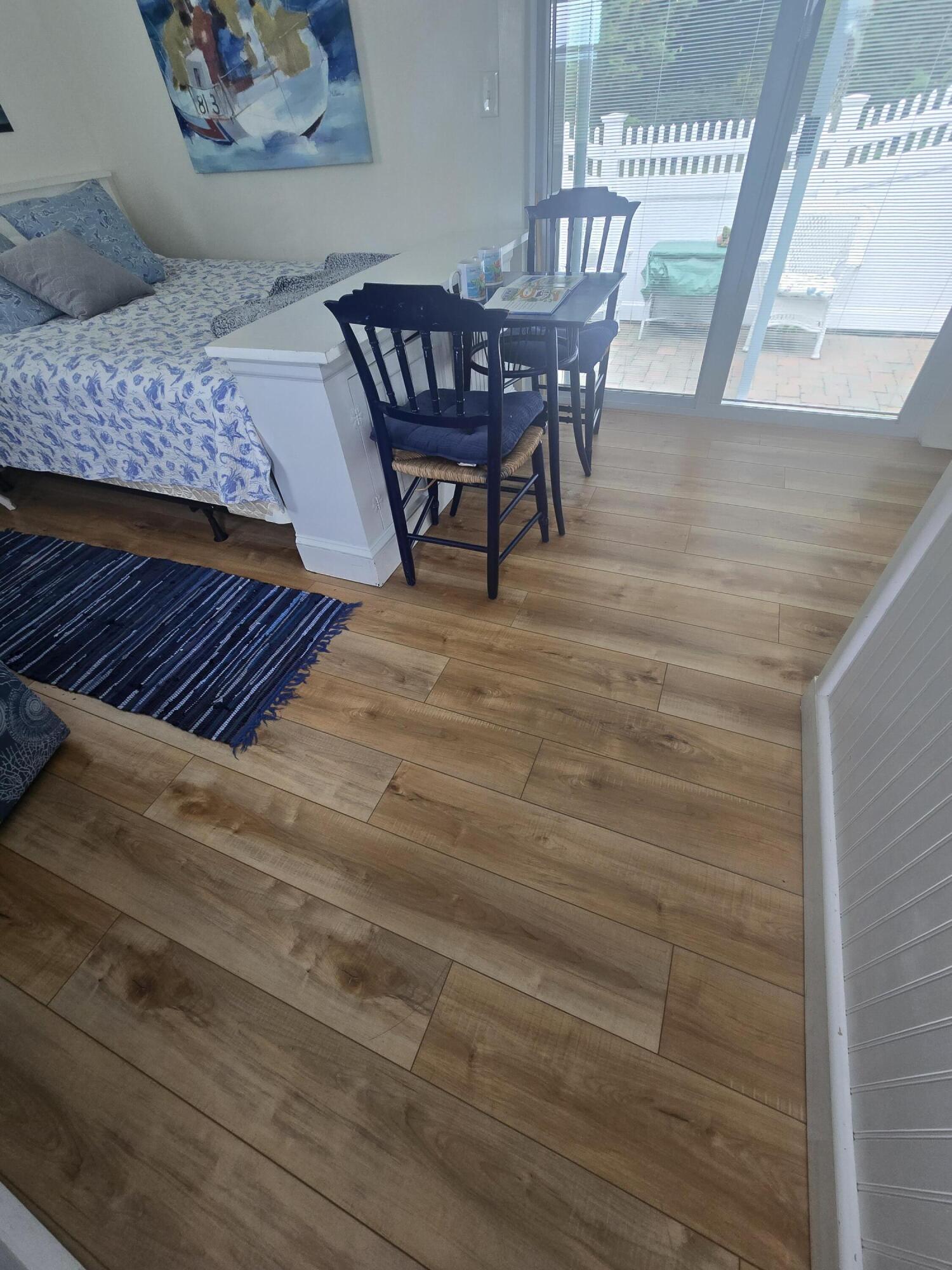 292 Route 28, Unit 1 Harwich, MA 02646 - Photo 13 of 29 a view of a dining room with furniture and wooden floor