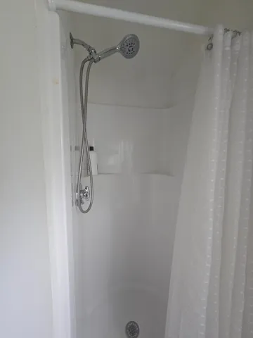 a view of a house with a yard and garage