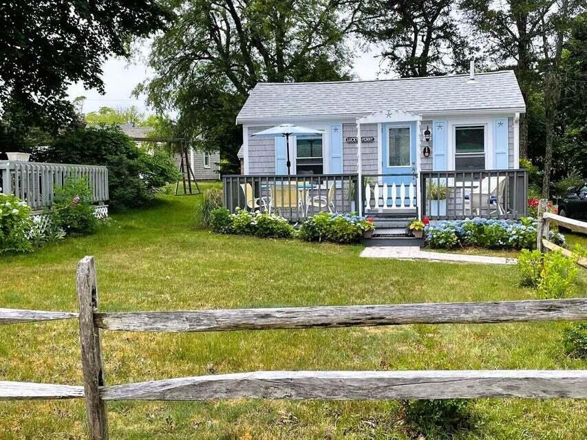292 Route 28, Unit 1 Harwich, MA 02646 - Photo 26 of 29 a front view of a house with a yard