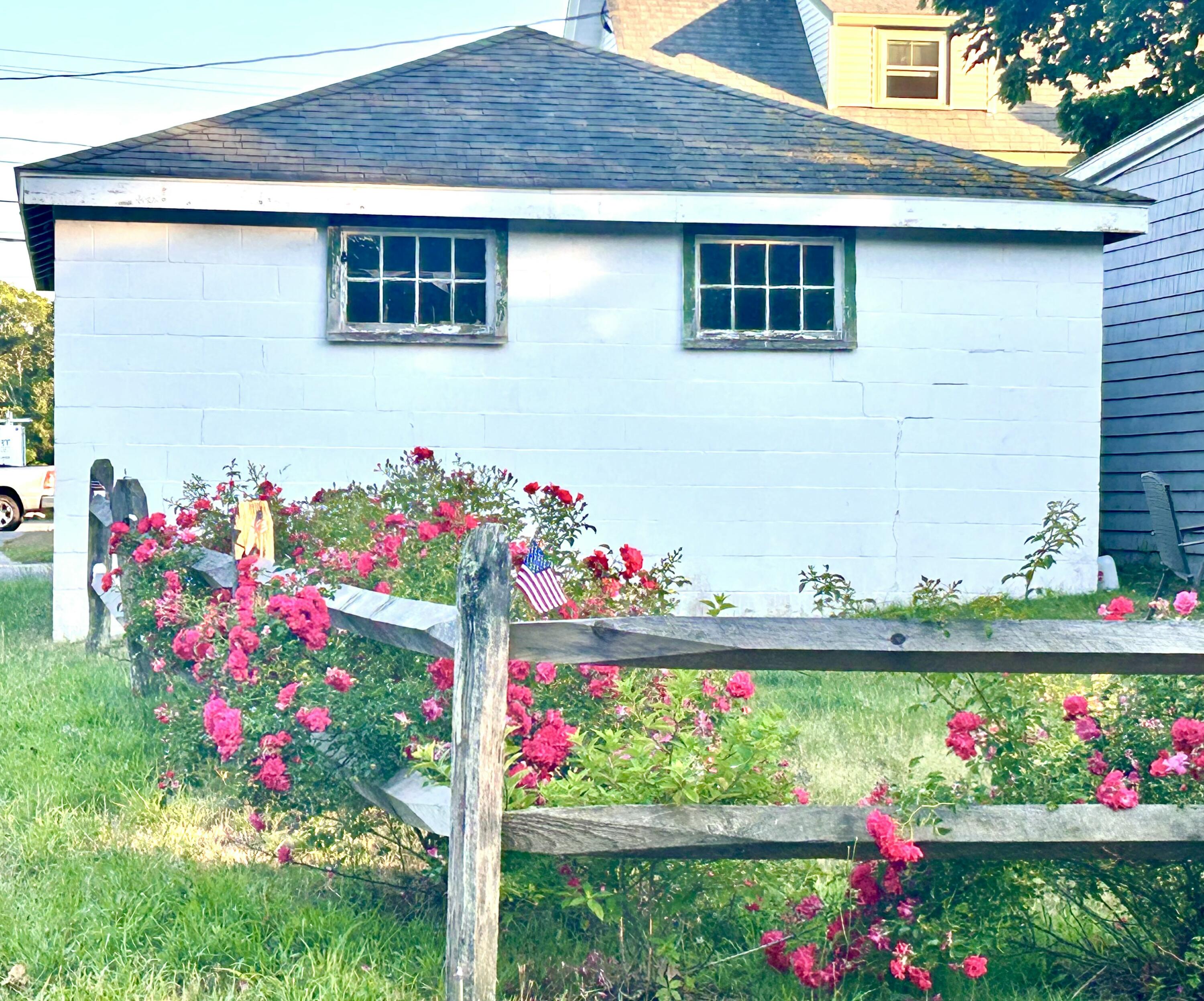 292 Route 28, Unit 1 Harwich, MA 02646 - Photo 28 of 29 a view of a flower in a yard