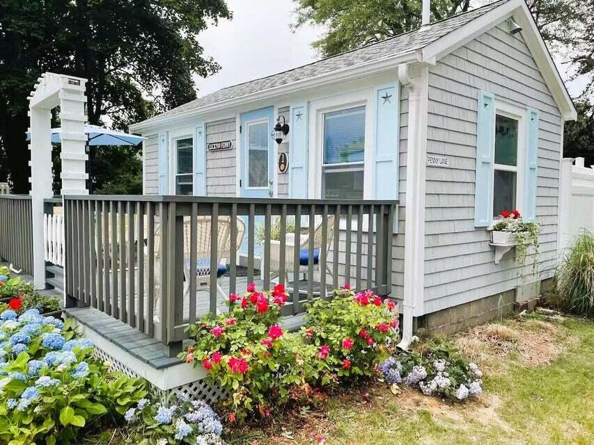 292 Route 28, Unit 1 Harwich, MA 02646 - Photo 6 of 29 a view of a porch with wooden fence