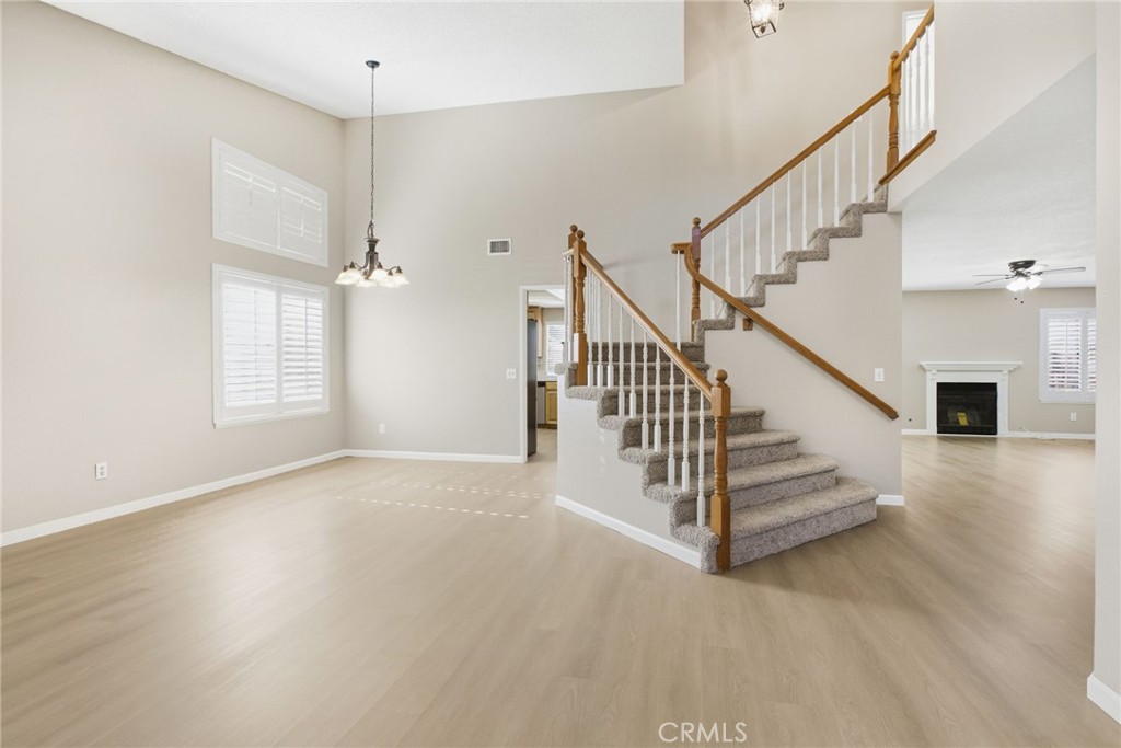 24333 Rimcrest Lane Moreno Valley, CA 92557 - Photo 13 of 62 a view of entryway and hall with wooden floor