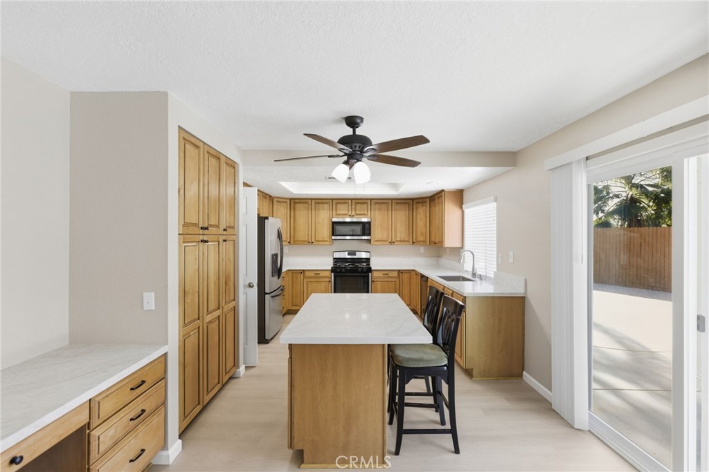 24333 Rimcrest Lane Moreno Valley, CA 92557 - Photo 16 of 62 a view of a dining room with furniture window and wooden floor