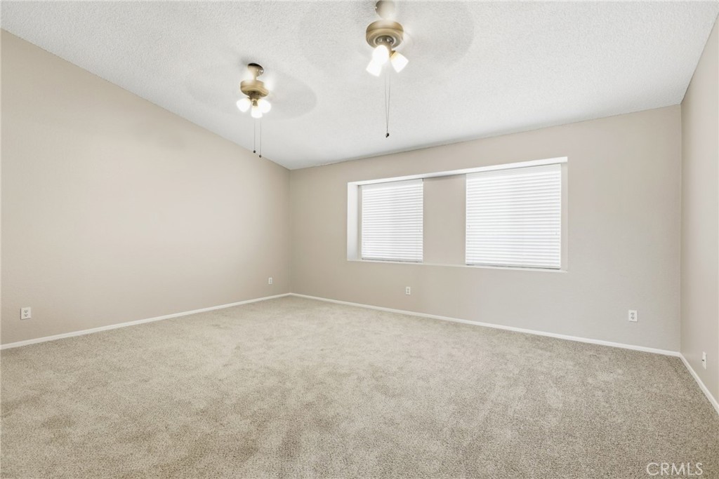 24333 Rimcrest Lane Moreno Valley, CA 92557 - Photo 24 of 62 an empty room with a window and a ceiling fan
