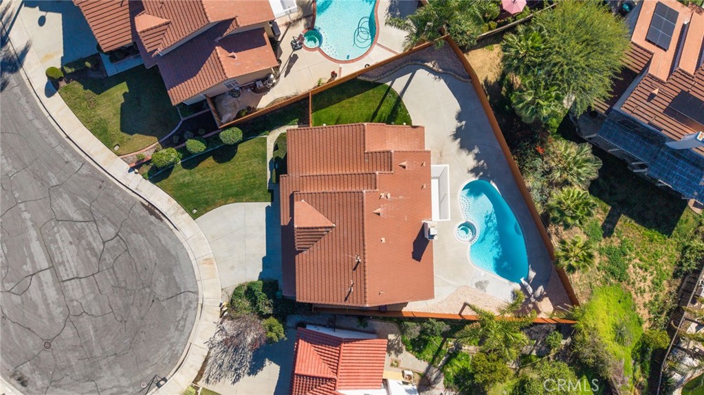 24333 Rimcrest Lane Moreno Valley, CA 92557 - Photo 36 of 62 an aerial view of a house with a yard and large trees