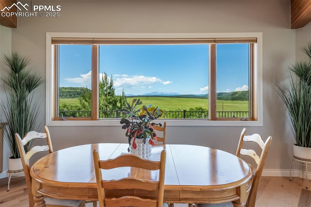 4586 East Best Road Larkspur, CO 80118 - Photo 12 of 50 Dining space with wood finished floors